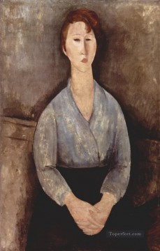 Mujer sentada vestida con blusa azul 1919 Amedeo Modigliani Pinturas al óleo